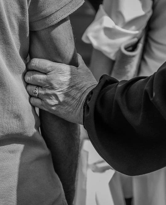 Caregiver's hand supporting an elderly client, companion care in Glen Ellyn