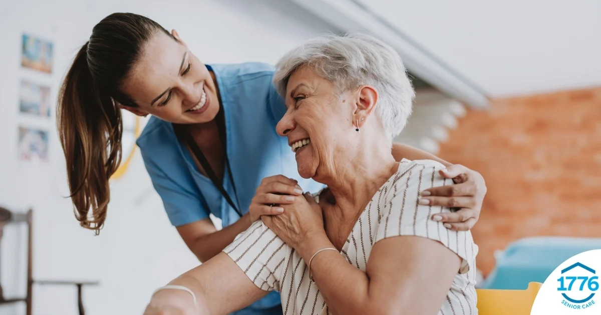 A female caregiver helping an older woman with stroke recovery at home.